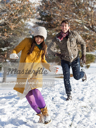 young couple together in the snow