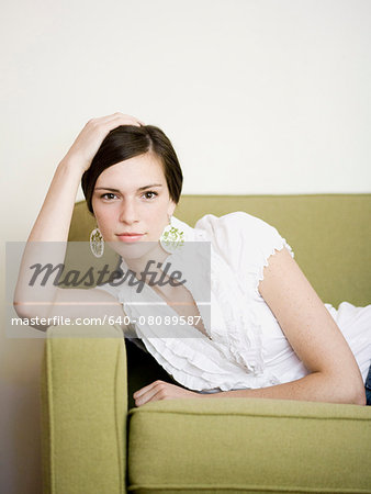 woman lying on a sofa