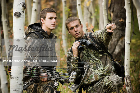two men hunting in the wilderness