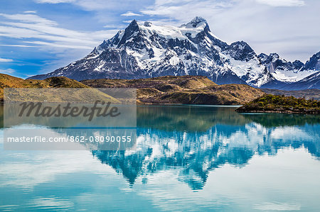 Chile, Torres del Paine, Magallanes Province. Cerro Paine Grande reflected in Lake Pehoe.  One of the principal attractions of Torres del Paine National Park is the magnificent Paine massif.