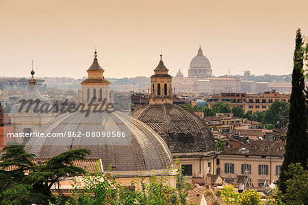 Italy, Italia. Latium, Lazio. Roma district. Rome, Roma. Villa Borghese. Pincio Hill. view of the domes of twins churches and St. Peter's Dome in the background.