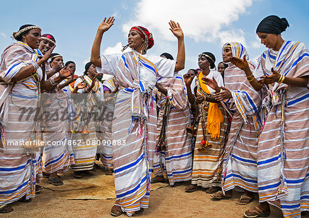 Kenya, Marsabit County, Kalacha.  Borana women sing and dance at the annual Kalacha Festival. Their  bells'  are fashioned from small gourds.