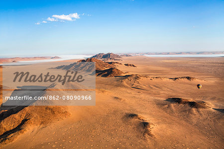 Africa, Namibia, Namib Desert, Sossusvlei. Hot air balloon floating over the Sossusvlei.