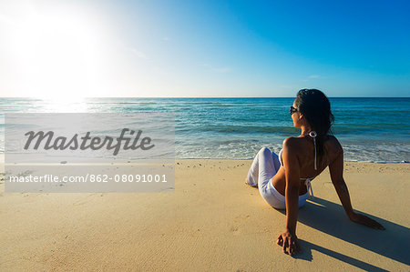 South East Asia, Philippines, The Visayas, Cebu, Bantayan Island, Sugar Beach, girl relaxing on the beach (MR)