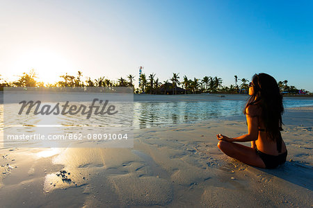 South East Asia, Philippines, The Visayas, Cebu, Bantayan Island, Sugar Beach, girl doing yoga (MR) South East Asia, Philippines, The Visayas, Cebu, Bantayan Island, Sugar Beach, girl doing yoga (MR)