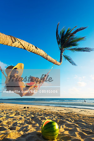 South East Asia, Philippines, The Visayas, Cebu, Bantayan Island, Sugar Beach, girl relaxing on the beach (MR)