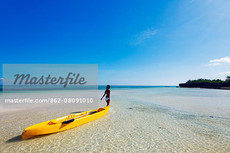 South East Asia, Philippines, The Visayas, Cebu, Bantayan Island, Paradise Beach, girl with a kayak (MR) South East Asia, Philippines, The Visayas, Cebu, Bantayan Island, Paradise Beach, girl with a kayak (MR)