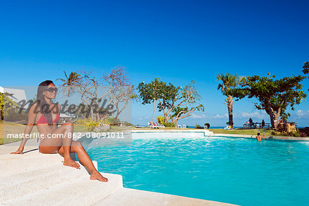 South East Asia, Philippines, The Visayas, Cebu, Bantayan Island, Paradise Beach, girl at Ogtong resort pool (MR)