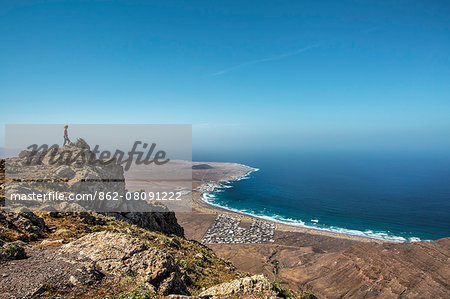 View from mountains Risco de Famara towards La Caleta de Famara, Lanzarote, Canary Islands, Spain