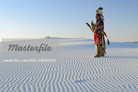 Native American in full regalia, White Sands National Monument, New Mexico, USA MR