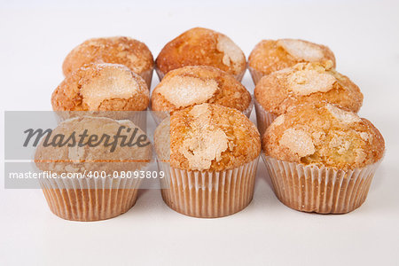 Traditional madeleines made with olive oil. Spanish typical small cake. Isolated over white background