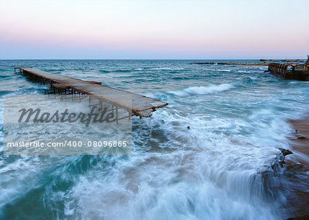 Evening sea storm and ruined pier (Black Sea, Bulgaria).