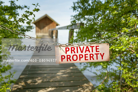 An image of an old private property sign