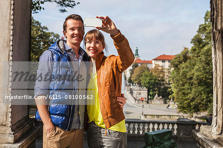 Young couple taking a self portrait, Munich, Bavaria, Germany