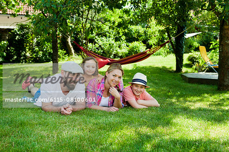 Family with two children relaxing in the garden, Munich, Bavaria, Germany