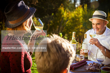 Family having a picnic in the garden, Munich, Bavaria, Germany