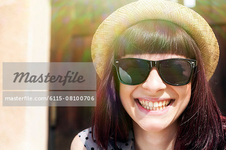 Young woman with straw hat and sunglasses, Osijek, Croatia