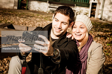 Young couple taking a self portrait outdoors