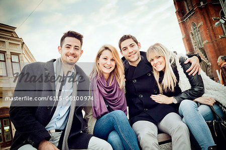 Portrait of friends taking a break in town