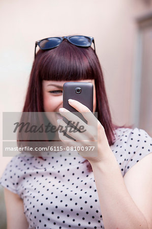 Young woman using smart phone, Osijek, Croatia