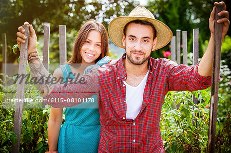 Portrait of young couple in vegetable garden