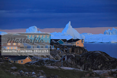 Village on water's edge at sunset, Arctic Ocean, Greenland