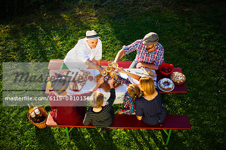 Family having a picnic in the garden, Munich, Bavaria, Germany