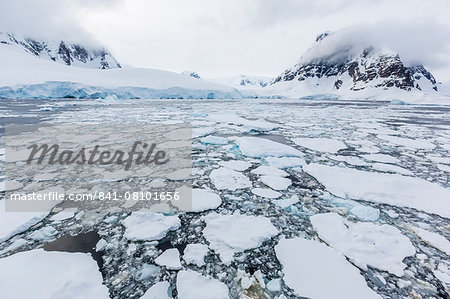 Ice floes choke the waters of the Lemaire Channel, Antarctica, Polar Regions Ice floes choke the waters of the Lemaire Channel, Antarctica, Polar Regions
