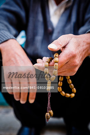 Hands holding worry beads, Bethlehem, West Bank, Palestine territories, Israel, Middle East