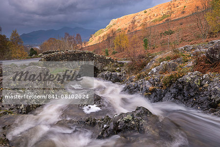 Rocky stream tumbling under Ashness Bridge in autumn, Lake District National Park, Cumbria, England, United Kingdom, Europe