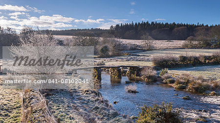 Frosty winter conditions at the old clapper bridge at Postbridge, Dartmoor, Devon, England, United Kingdom, Europe