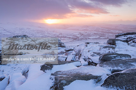 Snow covered rocky moorland at sunrise in winter, Great Staple Tor, Dartmoor National Park, Devon, England, United Kingdom, Europe