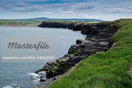 Trail to the Cliffs of Moher with the coastal village of Doolin in the background, Republic of Ireland Trail to the Cliffs of Moher with the coastal village of Doolin in the background, Republic of Ireland
