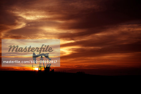 Pump Jack in Oilfield at Sunset, Saskatchewan, Canada Pump Jack in Oilfield at Sunset, Saskatchewan, Canada