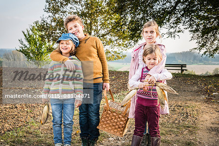 Children carrying picnic basket