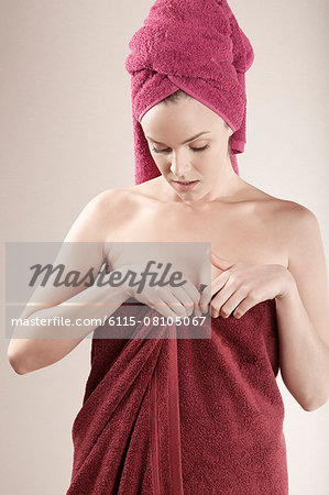 Young woman wrapped in towel