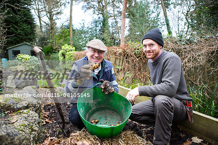 Two men harvesting potatoes, Bournemouth, County Dorset, UK, Europe