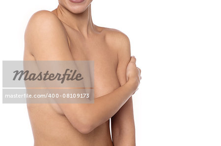 Beautiful woman covers her bare breasts