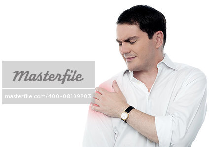 Middle aged man suffering from shoulder pain