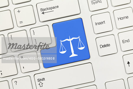 Close-up view on white conceptual keyboard - Law symbol (blue key)