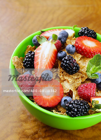 homemade granola muesli with berries (strawberries, raspberries, blueberries) for breakfast