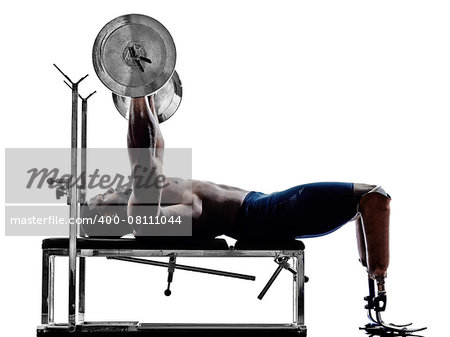 one muscular handicapped man body builders building weights with legs prosthesis in silhouette on white background