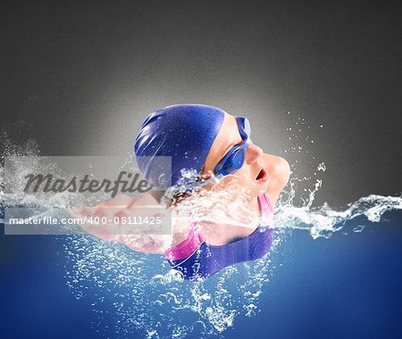 Girl swims in the pool in freestyle