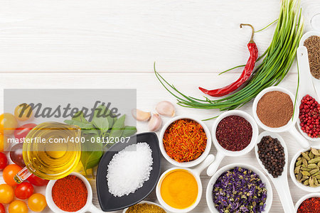 Various spices on white wooden background. Top view with copy space