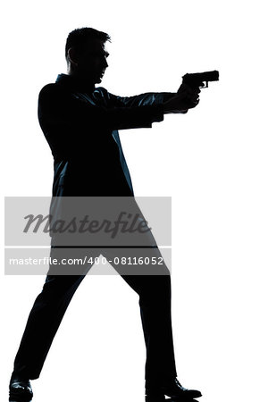 one  spy criminal policeman detective man aiming shooting gun full length silhouette in studio isolated white background