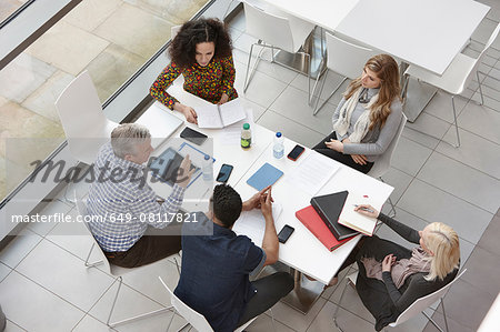 Overhead view of business team meeting at conference table