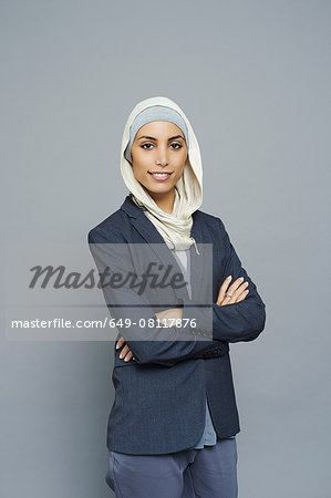 Studio portrait of young businesswoman wearing hijab