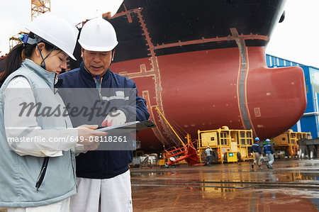 Workers discussing plans at shipyard, GoSeong-gun, South Korea