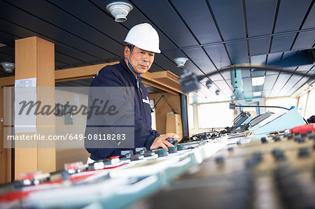Worker using equipment at shipping port, GoSeong-gun, South Korea