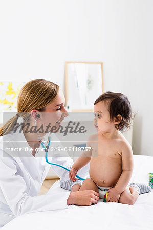 Paediatrician doing assessment of baby boy